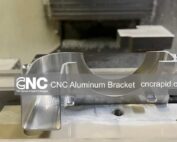 Custom CNC machined aluminum bracket freshly milled from billet before finishing